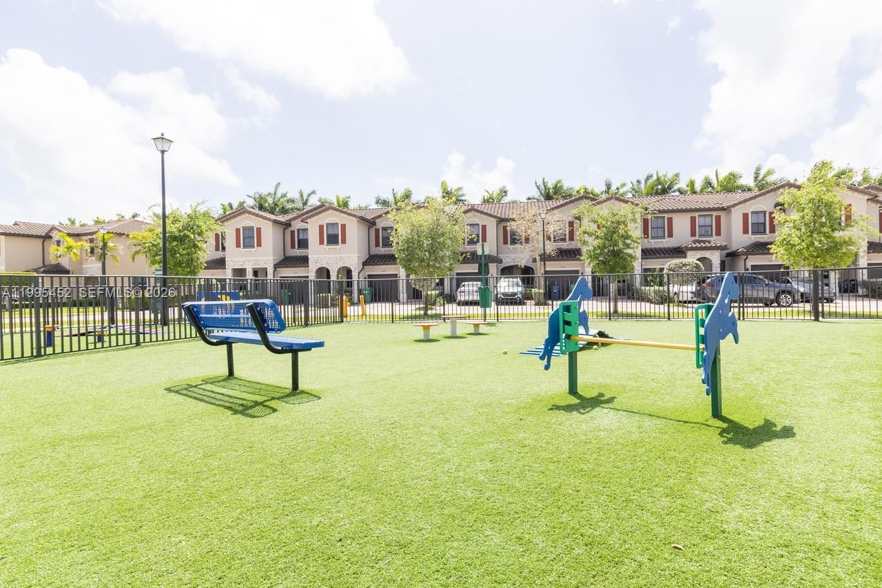24920 Southwest 112th Court Homestead, FL 33032 - Photo 47 of 48 a swimming pool with outdoor seating and yard