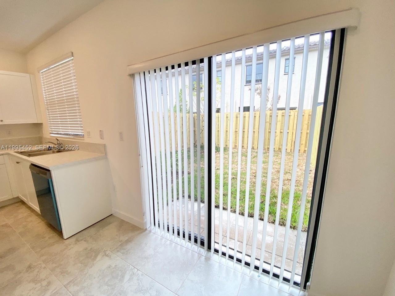 24920 Southwest 112th Court Homestead, FL 33032 - Photo 9 of 48 a view of a utility room with a window
