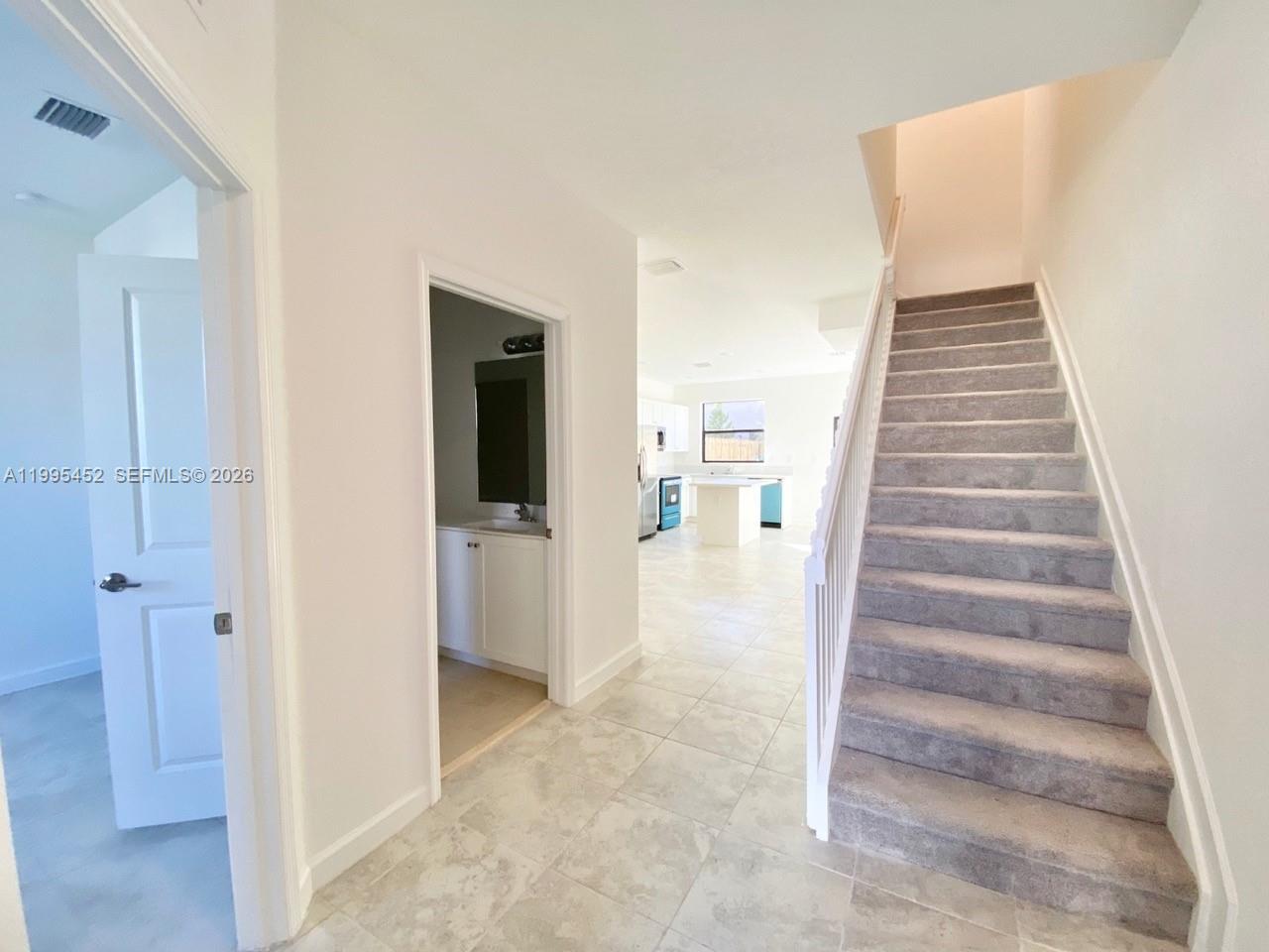 24920 Southwest 112th Court Homestead, FL 33032 - Photo 10 of 48 a view of a hallway with wooden floor and entryway