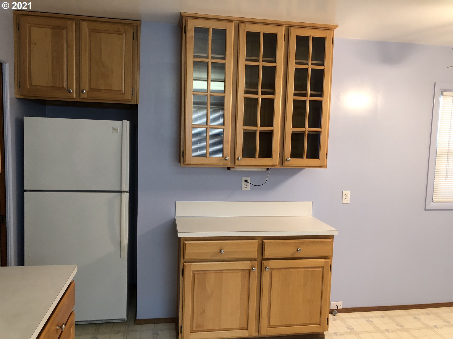 2293 Norkenzie Road Eugene, OR 97401 - Photo 11 of 32 a kitchen with a refrigerator and cabinets