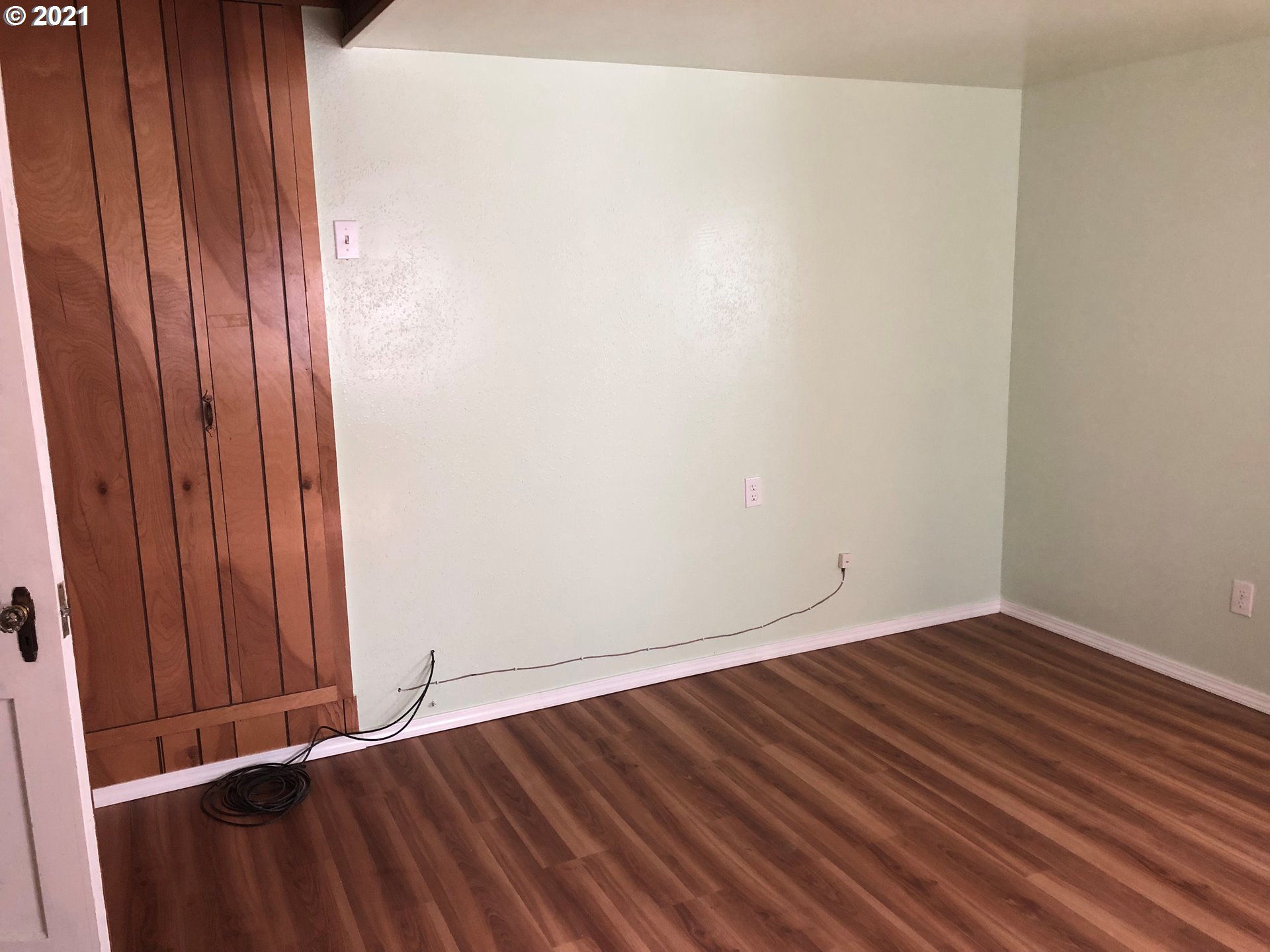 2293 Norkenzie Road Eugene, OR 97401 - Photo 14 of 32 a view of an empty room with wooden floor