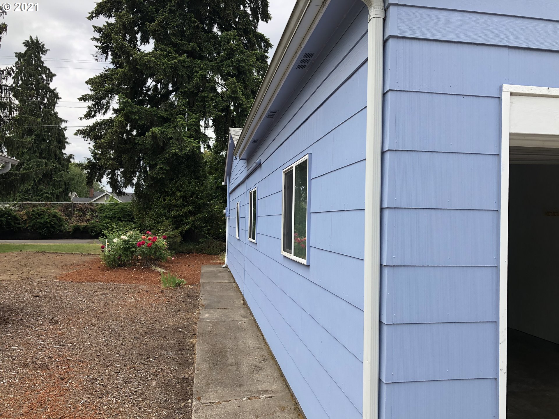 2293 Norkenzie Road Eugene, OR 97401 - Photo 5 of 32 a view of a house with a backyard