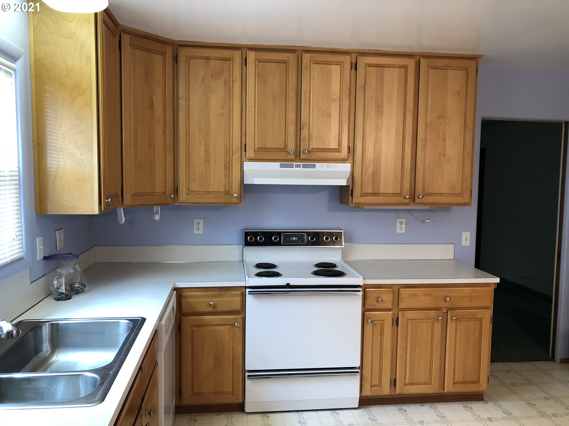2293 Norkenzie Road Eugene, OR 97401 - Photo 8 of 32 a kitchen with stainless steel appliances granite countertop a sink stove and refrigerator