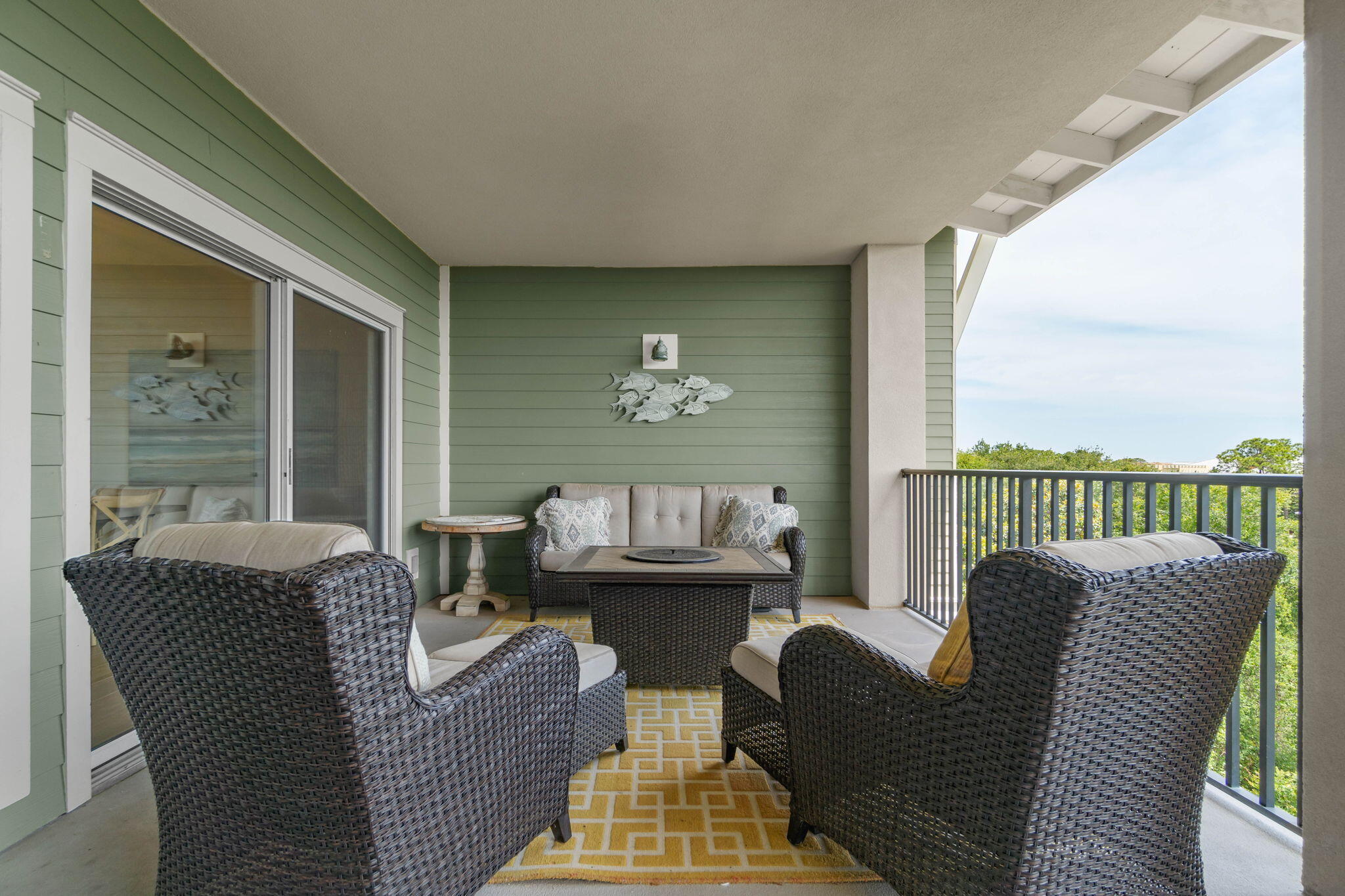1732 West County Highway 30A, Unit 402 Santa Rosa Beach, FL 32459 - Photo 29 of 32 a balcony with furniture and a floor to ceiling window