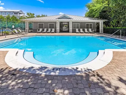 a view of a house with roof deck and sitting area