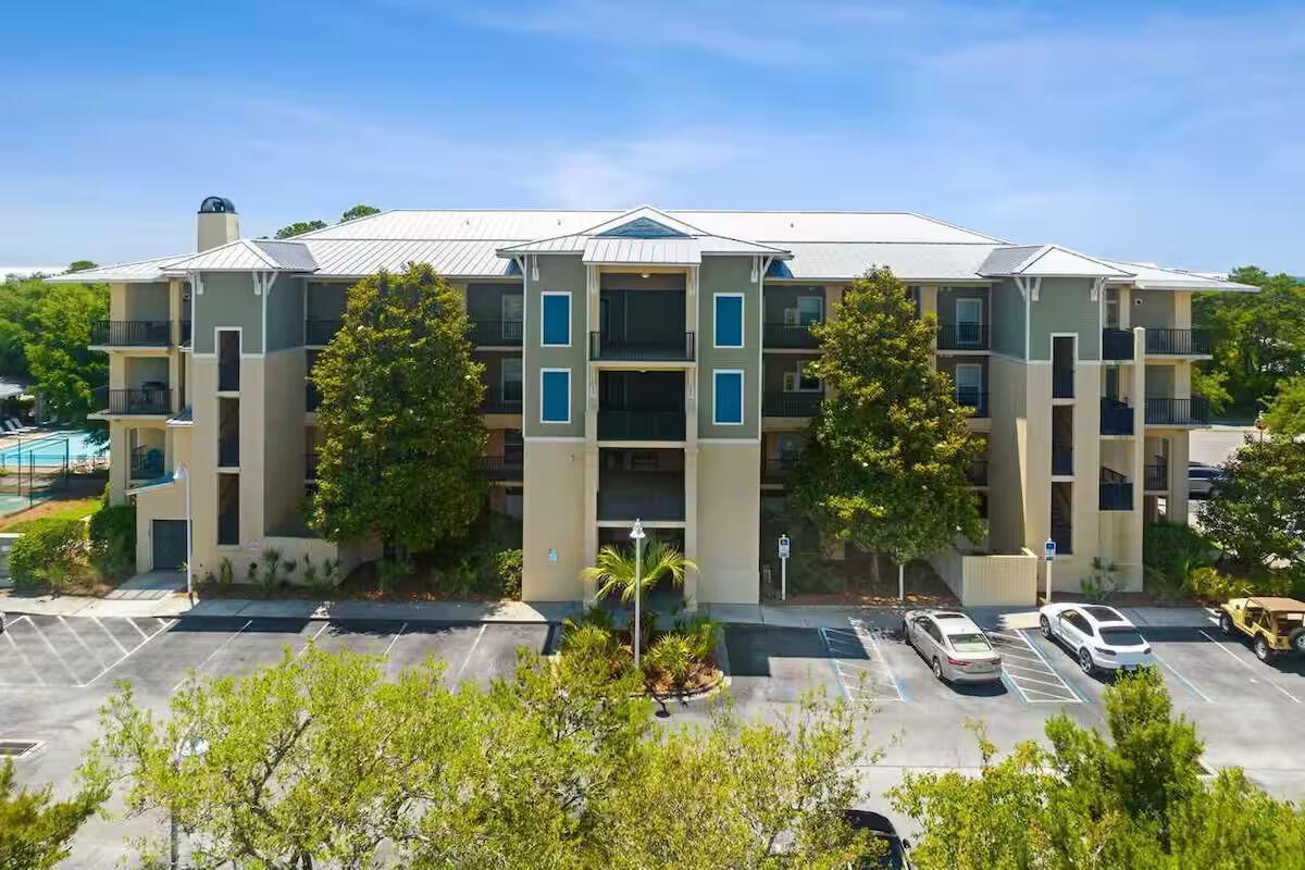 1732 West County Highway 30A, Unit 402 Santa Rosa Beach, FL 32459 - Photo 4 of 32 a view of a house with backyard and swimming pool