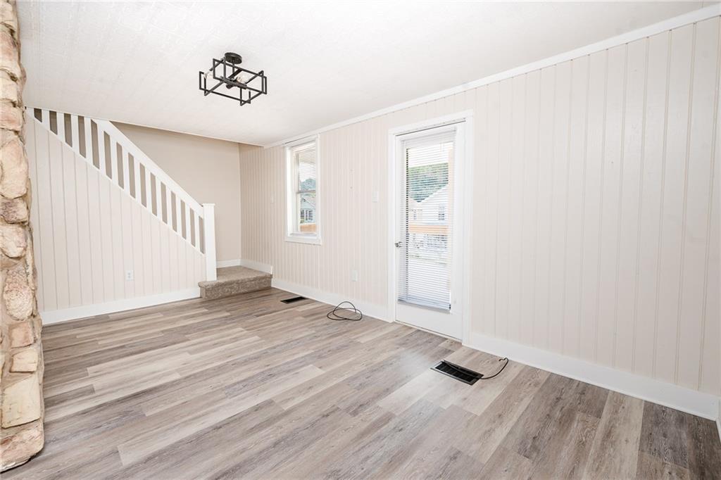 1909 Barr Slope Road Clymer, PA 15728 - Photo 6 of 35 a view of an empty room with wooden floor and a window