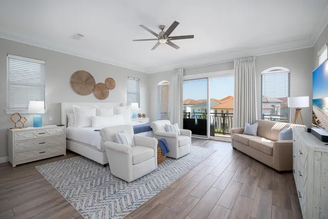 a bedroom with a bed and a flat screen television