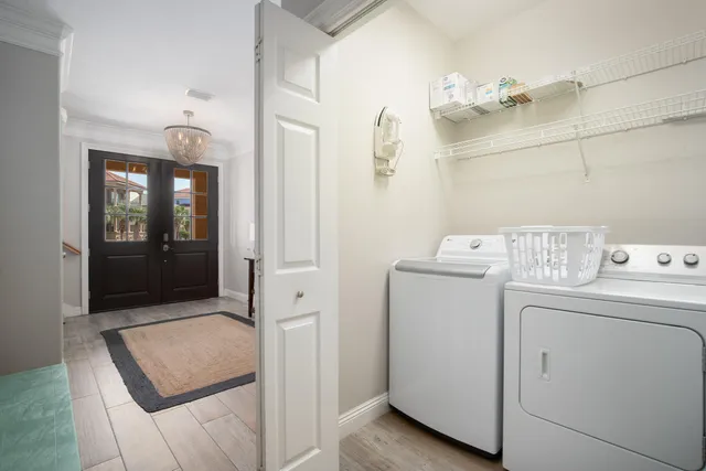 a view of a dining room with furniture and a window