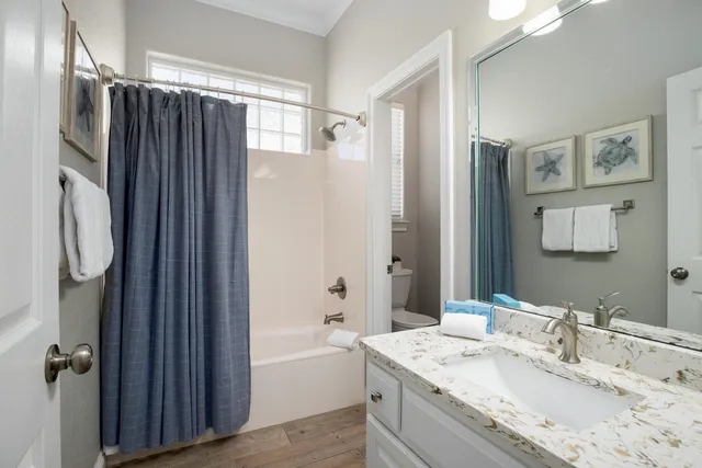 a bedroom with double bed and a window