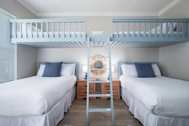 a balcony with furniture and a potted plant