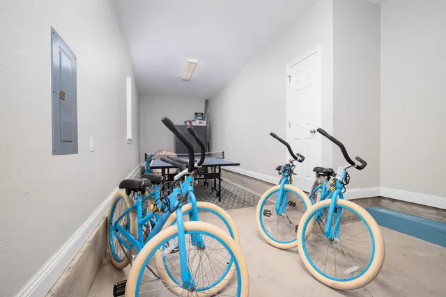 an aerial view of residential houses with outdoor space and river