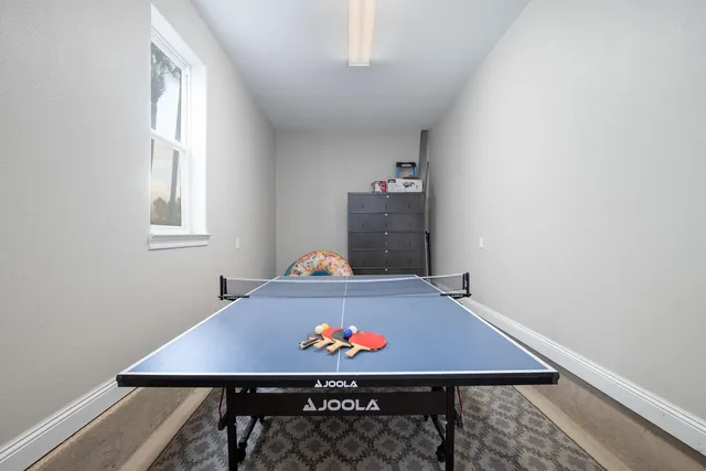 an aerial view of residential houses with outdoor space and river