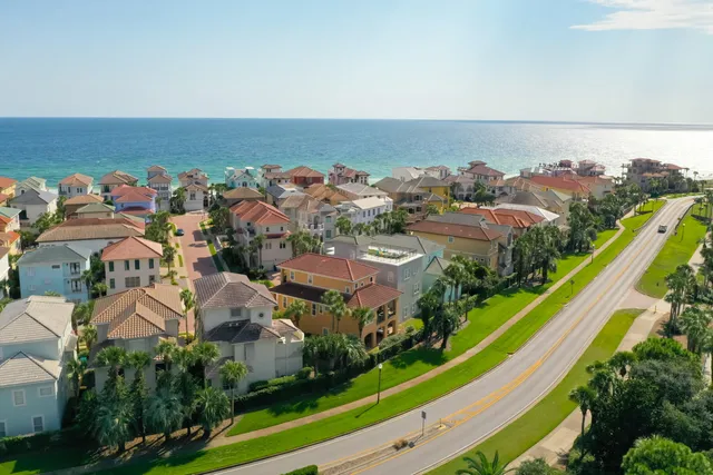 an aerial view of residential houses with outdoor space