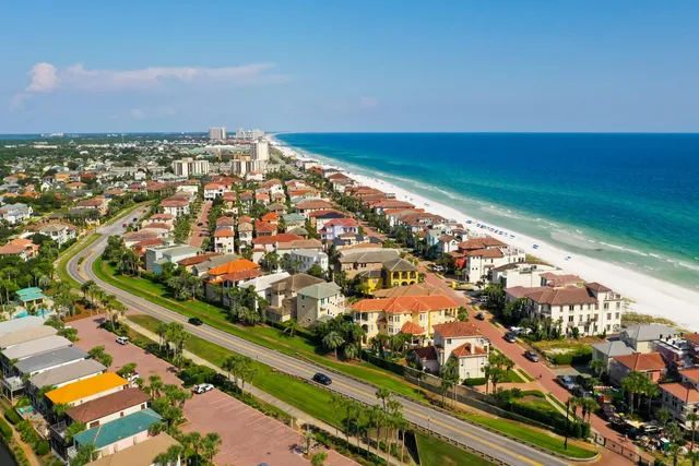a view of a building with a yard and garage