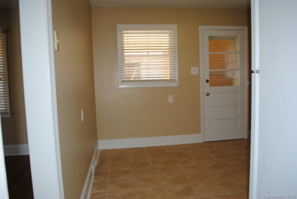 2057 Eaton Road Charlotte, NC 28205 - Photo 5 of 13 a view of an empty room with closet and a window