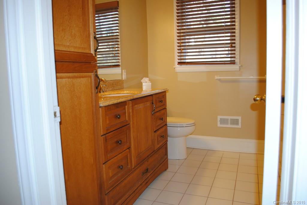 2057 Eaton Road Charlotte, NC 28205 - Photo 9 of 13 a bathroom with a sink a toilet and shower