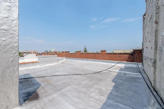 a view of a patio with couches table and chairs and potted plants