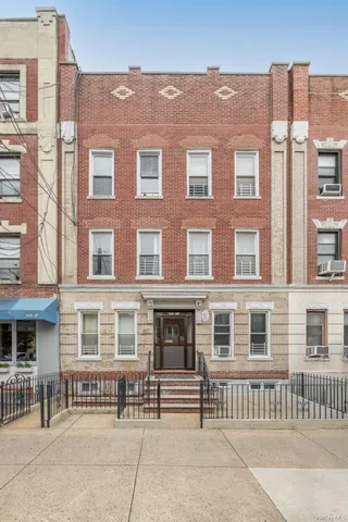 a front view of a building with a porch