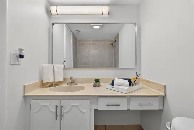 a bathroom with a sink and a mirror
