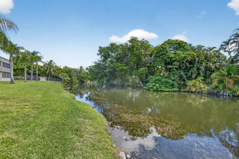 a view of a lake with a yard