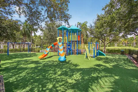 a view of a park with a slide