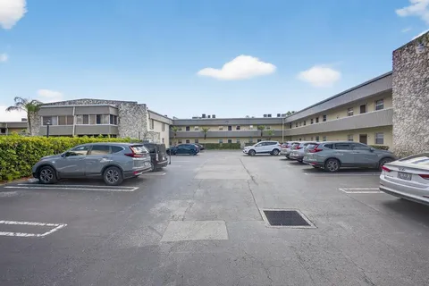 a view of cars parked in a parking lot
