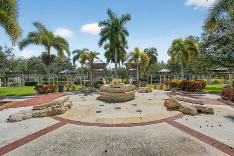 a view of a swimming pool with a table and chair