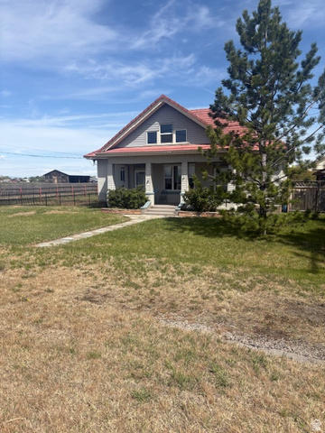 5264 West 5500th Street South Hooper, UT 84315 - Photo 2 of 20 Bungalow-style home with a porch and a tile roof