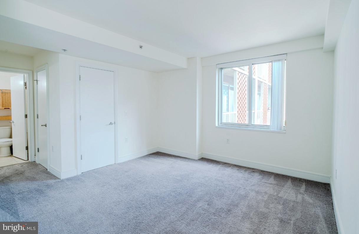 800 4th Street Southwest, Unit S501 Washington, DC 20024 - Photo 9 of 26 a view of an empty room with a window