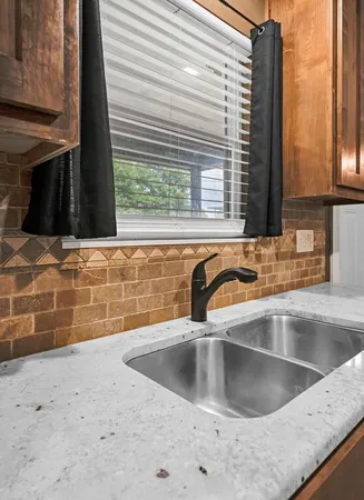 a view kitchen with sink and window