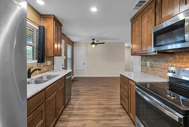 a kitchen with a stove and a microwave