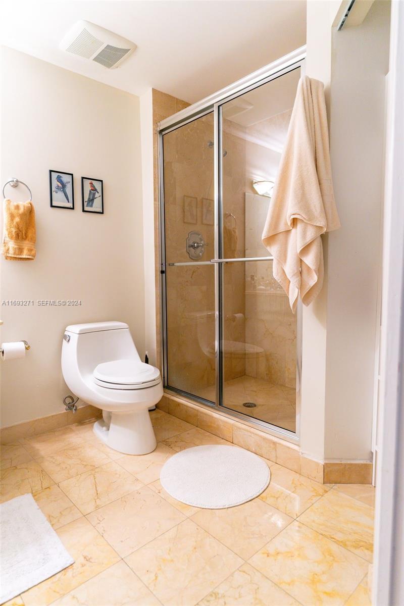 9595 Collins Avenue, Unit N9C Surfside, FL 33154 - Photo 7 of 31 a bathroom with a toilet and a shower