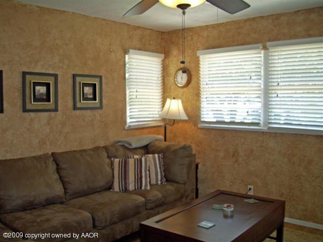 5108 South Bonham Street Amarillo, TX 79110 - Photo 2 of 13 a living room with furniture and a window