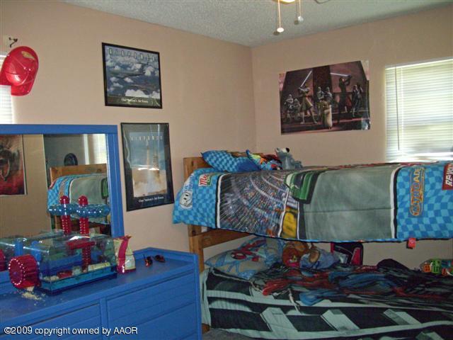 5108 South Bonham Street Amarillo, TX 79110 - Photo 7 of 13 a room with toys and dresser