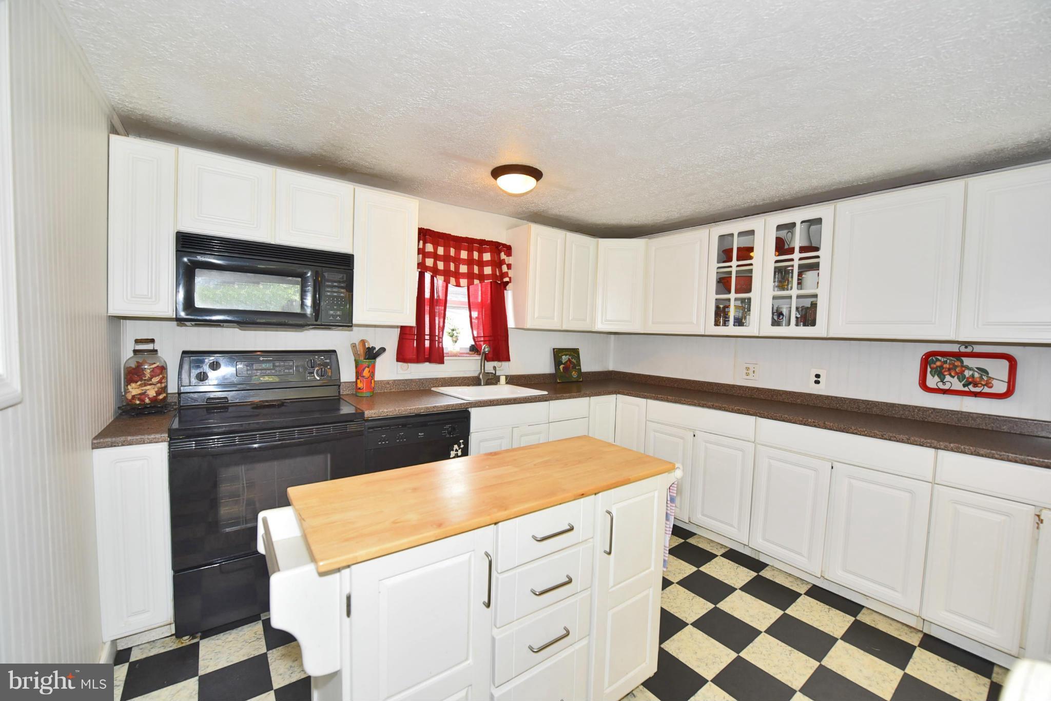417 Reckord Road Fallston, MD 21047 - Photo 3 of 30 a kitchen with granite countertop a sink cabinets and window