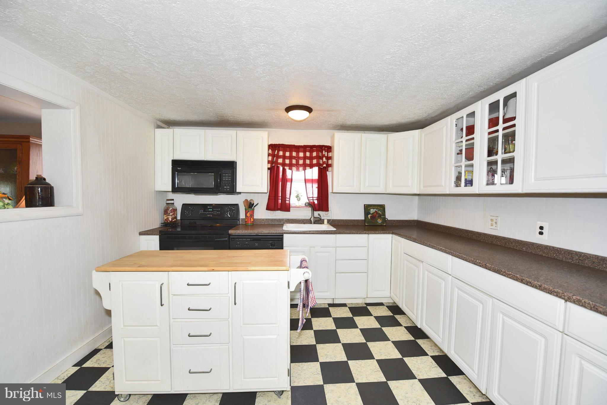 417 Reckord Road Fallston, MD 21047 - Photo 9 of 30 a kitchen with a stove a sink and a microwave