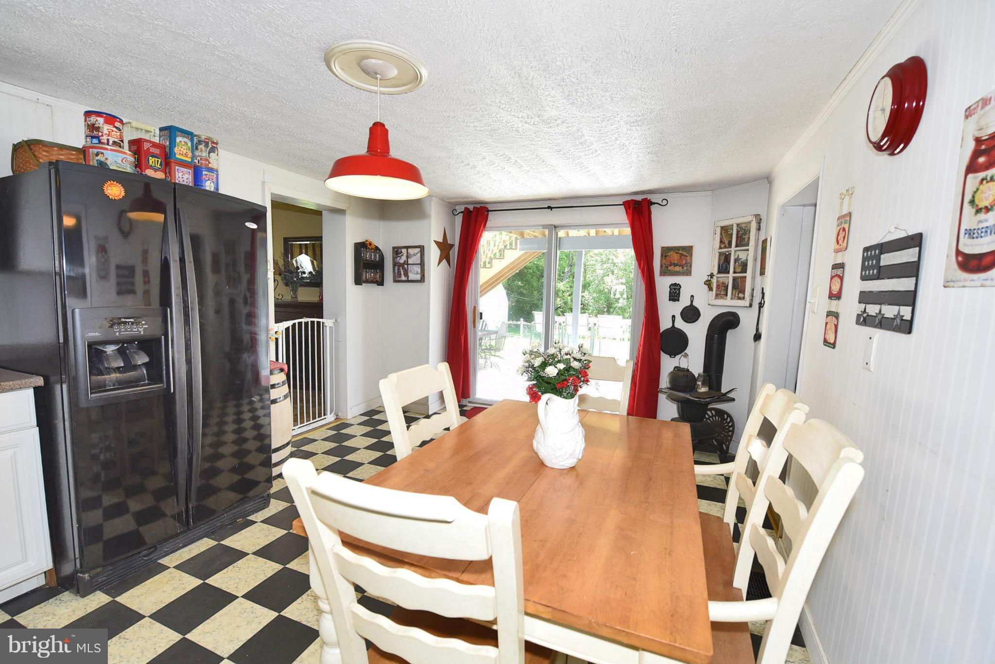 417 Reckord Road Fallston, MD 21047 - Photo 10 of 30 a dining room with furniture and a chandelier