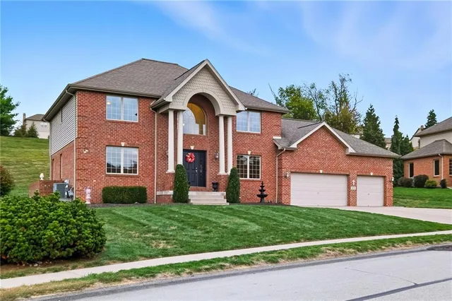front view of a house with a yard