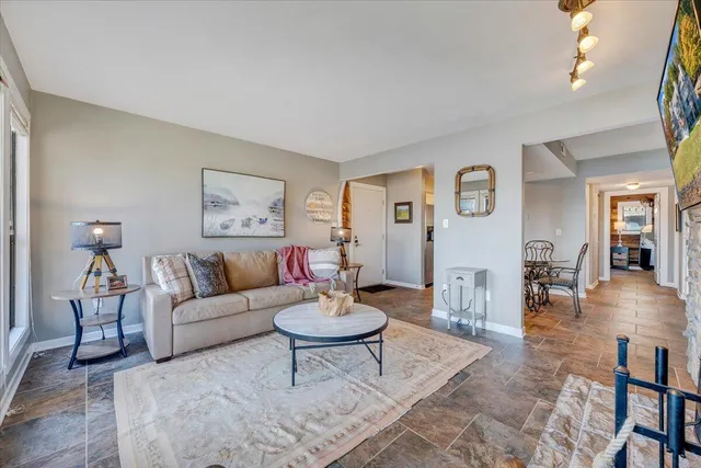 a view of a hallway with wooden shelves