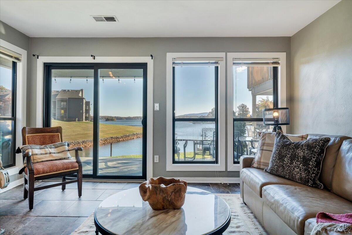 100 Dockside Circle, Unit 201 Moneta, VA 24121 - Photo 14 of 52 a living room with furniture and a large window