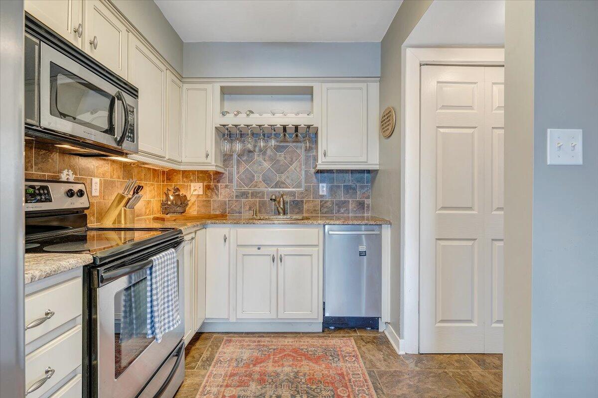 100 Dockside Circle, Unit 201 Moneta, VA 24121 - Photo 17 of 52 a kitchen with stainless steel appliances granite countertop a stove and cabinets
