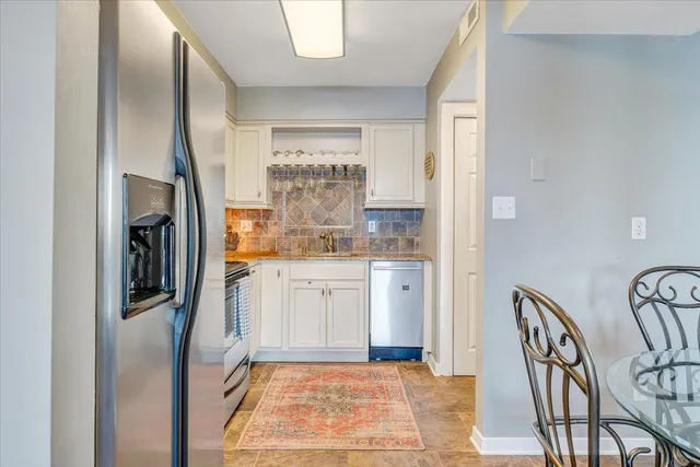a view of a swimming pool with lounge chair