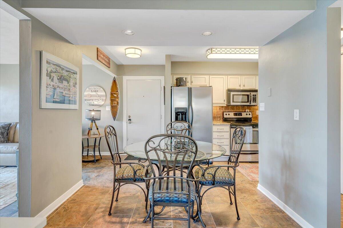100 Dockside Circle, Unit 201 Moneta, VA 24121 - Photo 34 of 52 a view of a dining room with furniture