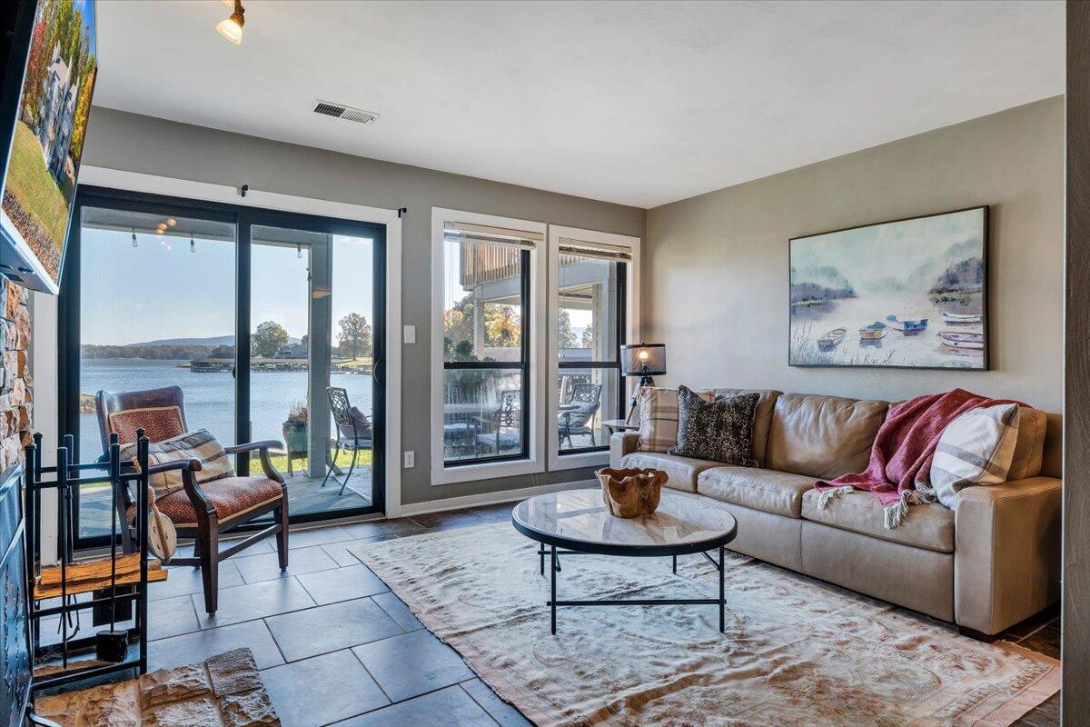 100 Dockside Circle, Unit 201 Moneta, VA 24121 - Photo 9 of 52 a living room with furniture and a large window