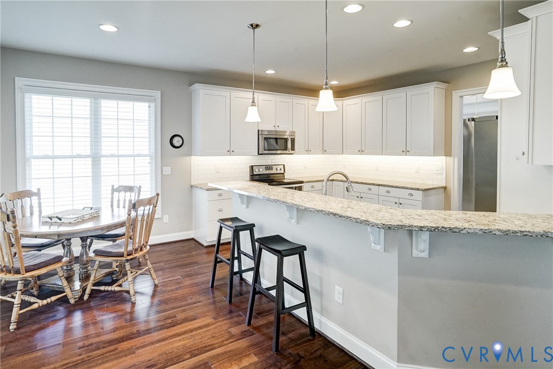 3606 Edenfield Road Midlothian, VA 23113 - Photo 25 of 67 Kitchen featuring white cabinetry, light-toned cou