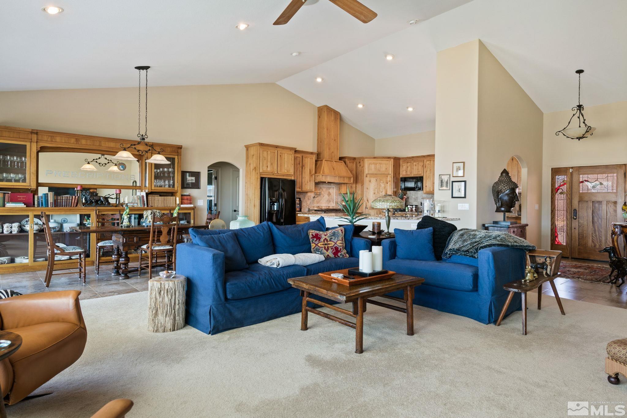 2428 Hasbita Lane Minden, NV 89423 - Photo 11 of 33 a living room with furniture kitchen view and a chandelier