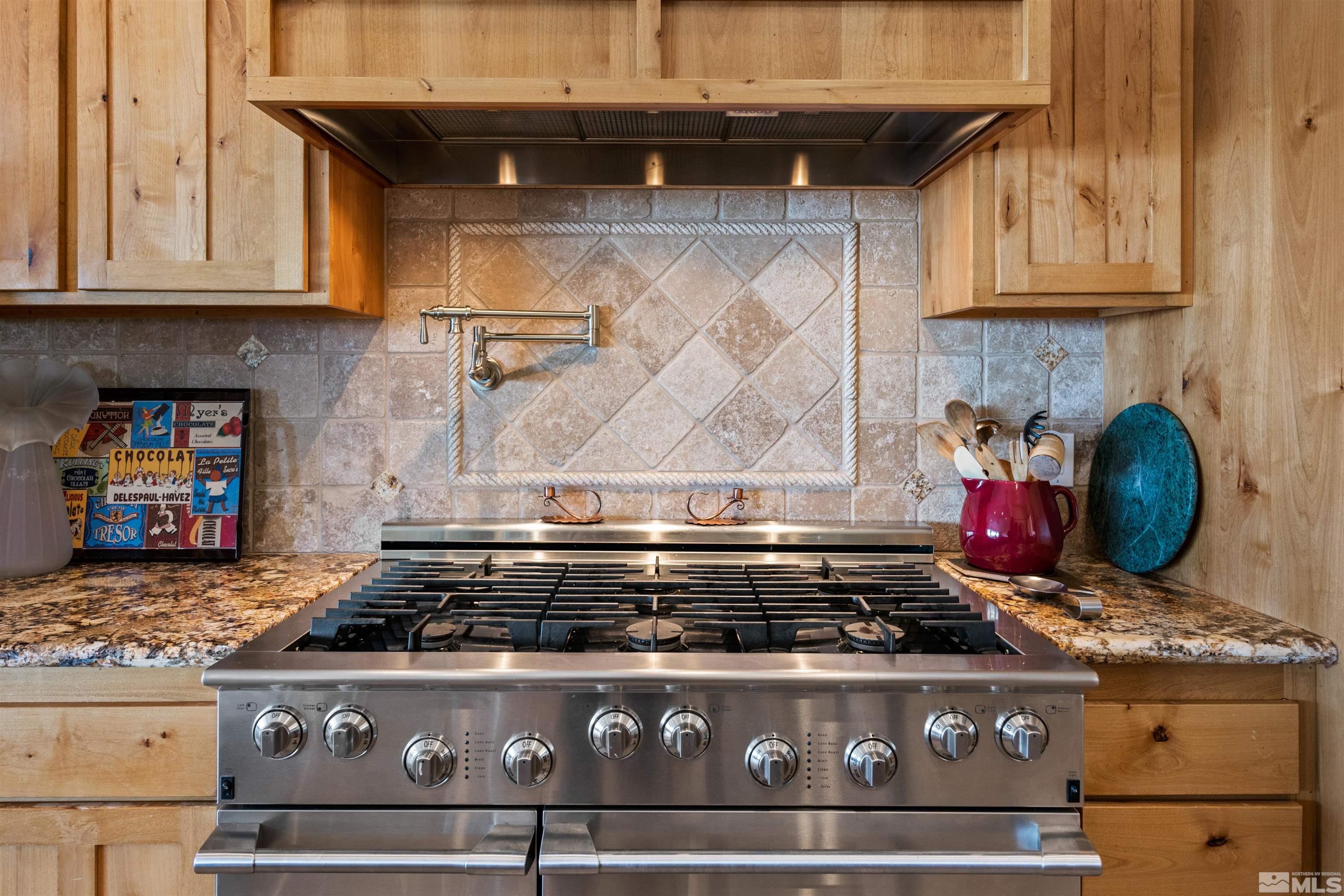 2428 Hasbita Lane Minden, NV 89423 - Photo 14 of 33 a stove sitting inside of a kitchen with granite countertop wooden cabinets