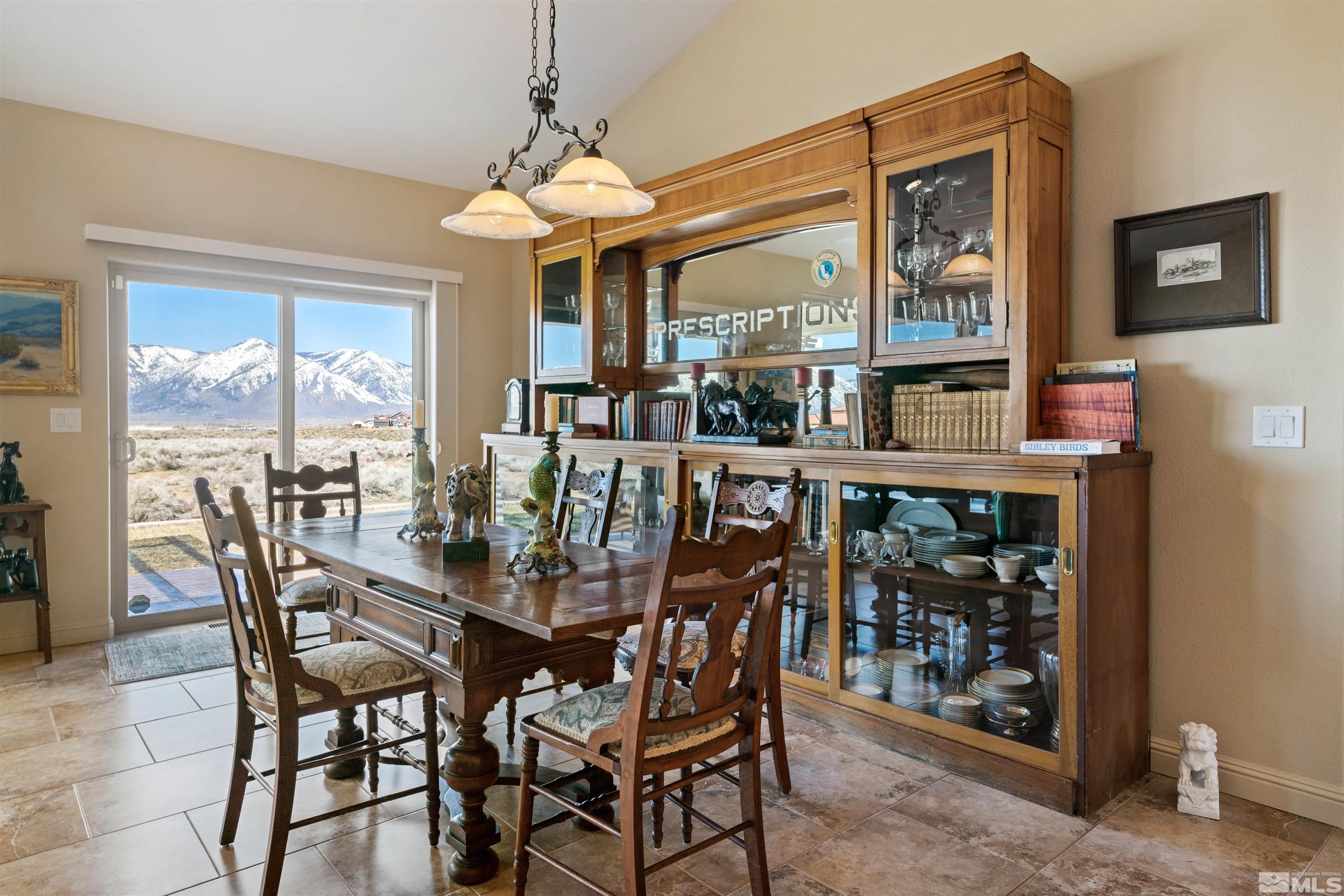 2428 Hasbita Lane Minden, NV 89423 - Photo 16 of 33 a dining room with furniture a chandelier and window