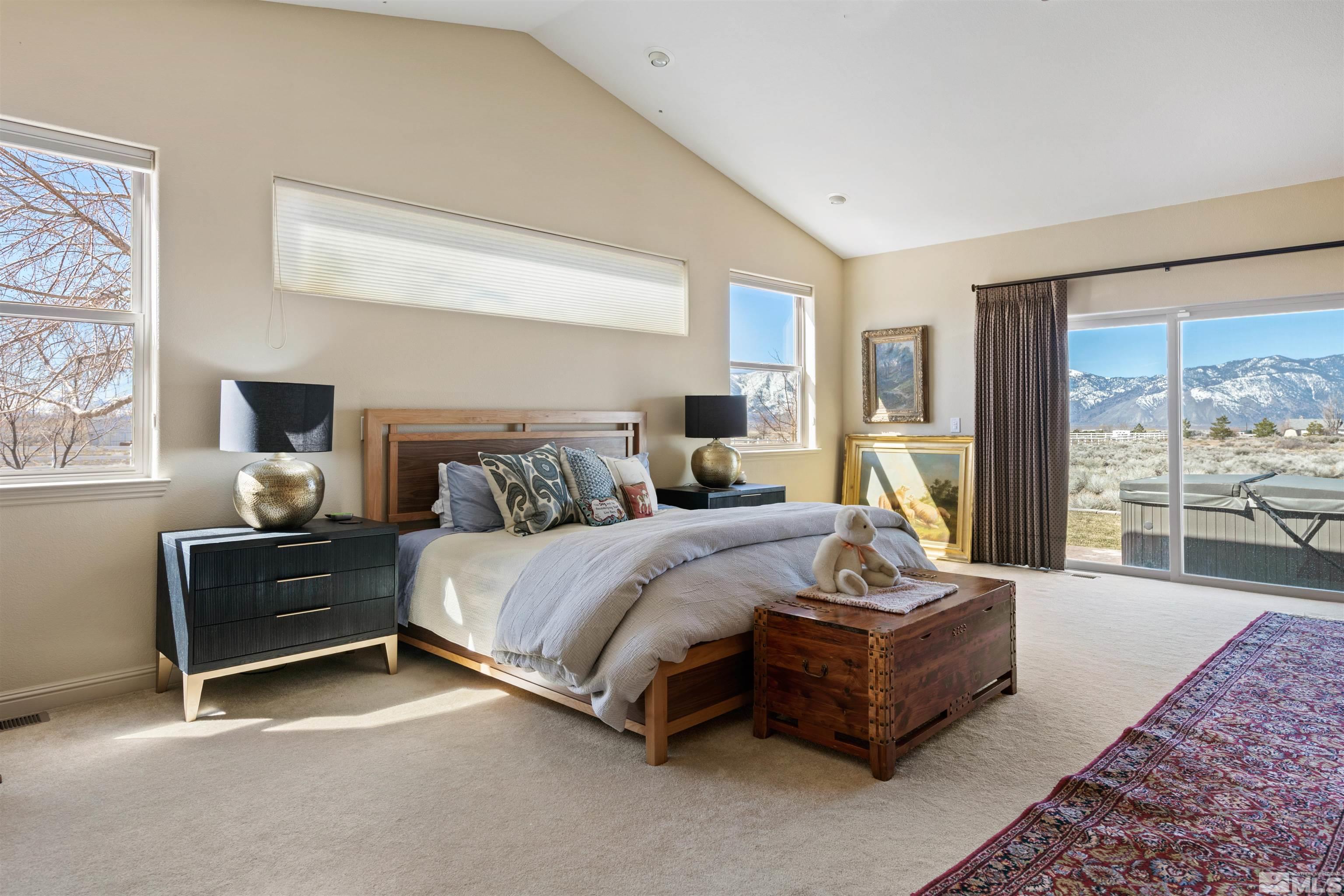 2428 Hasbita Lane Minden, NV 89423 - Photo 17 of 33 a spacious bedroom with a bed and large window